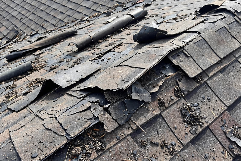 Sample customer photo: damaged roof shingles